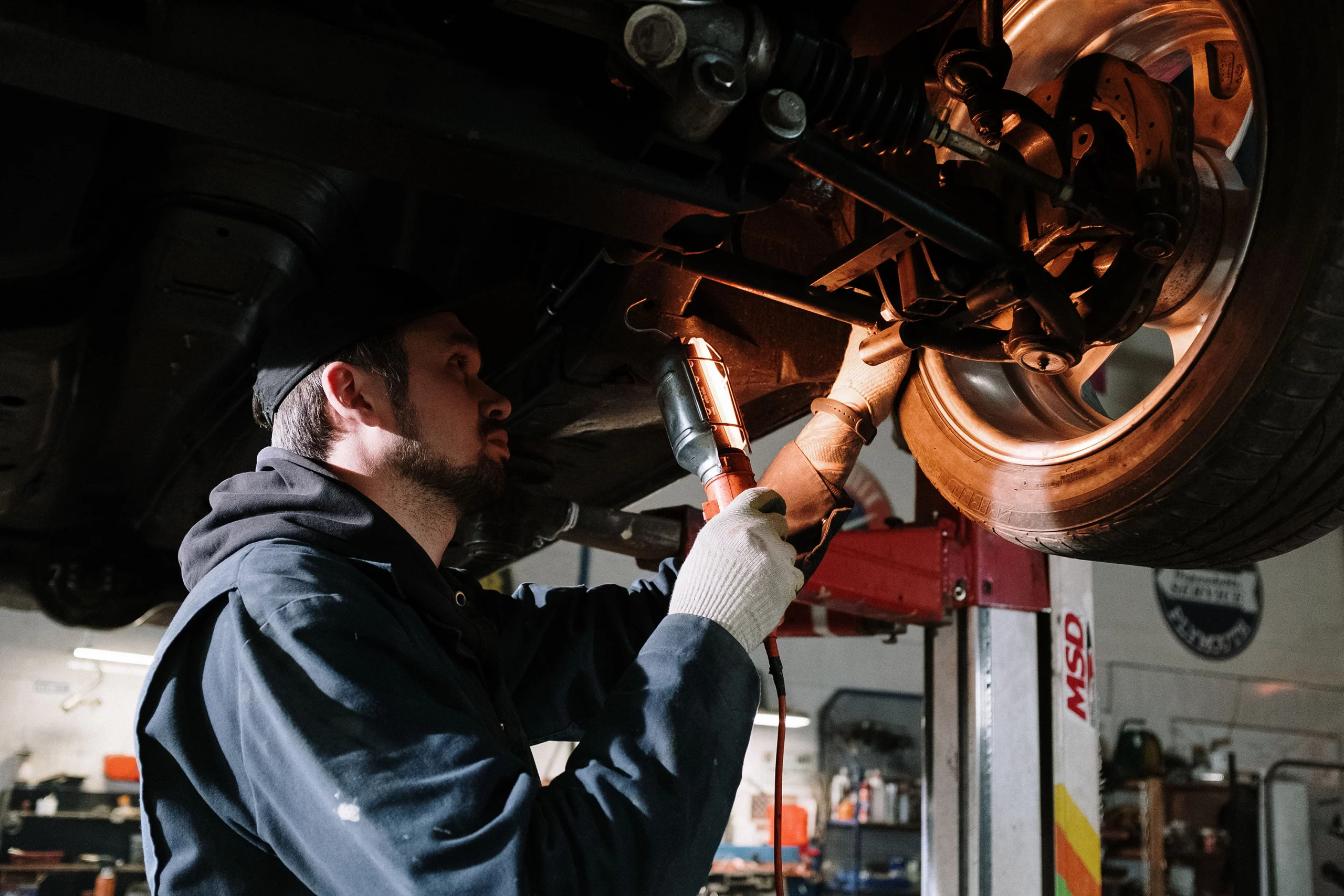 Technician performing a wheel alignment service