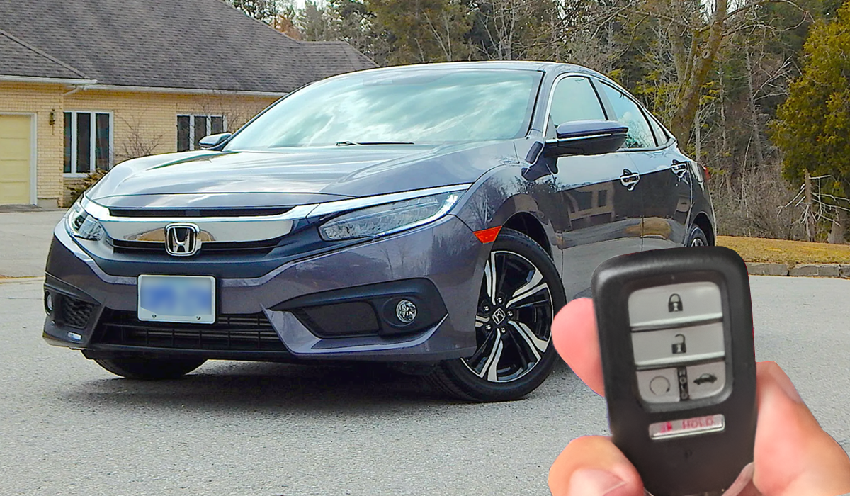 Customer holding keys to their new Honda Civic