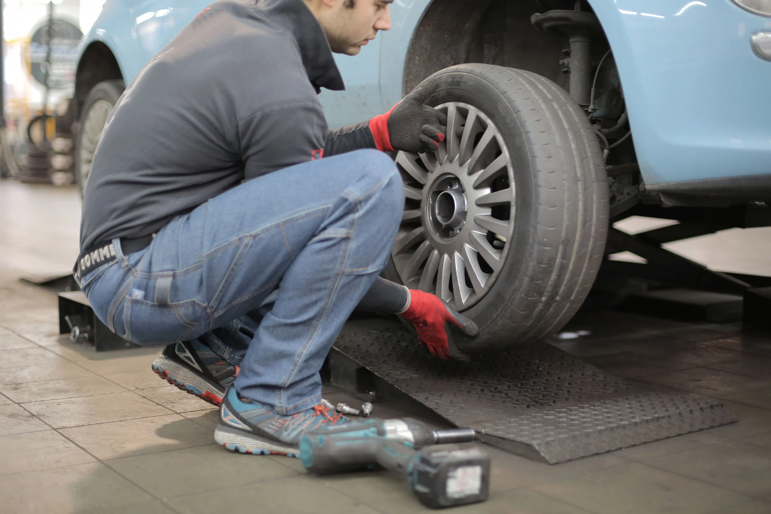 Mechanic changing a tire during a rotation service