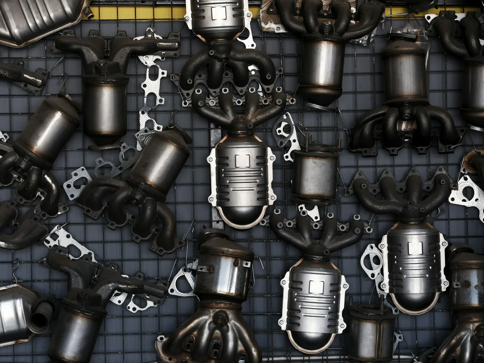 New exhaust manifolds and catalytic converters laid out on a grid